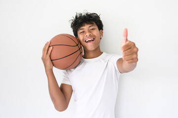 black teens in sportswear playing basketball game on studio white background
