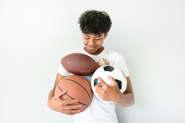 black teens in sportswear playing multi sport basketball soccer football game on studio white background