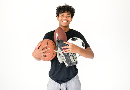 black teens in sportswear playing multi sport basketball soccer football game on studio white background