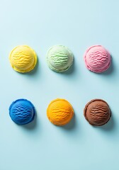 Colorful Ice Cream Scoops on Blue Background - A Sweet Summer Treat.