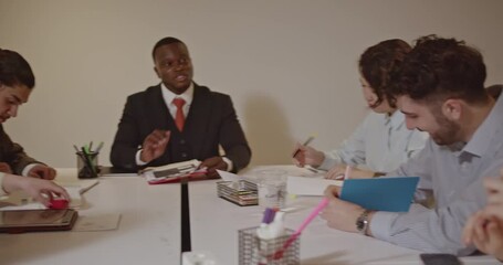 A diverse team of business professionals collaborates on a project during a productive meeting, sharing ideas and insights. - Powered by Adobe