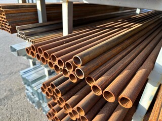 Rusty welded steel pipes. Pipes made of corten steel. The range of building materials