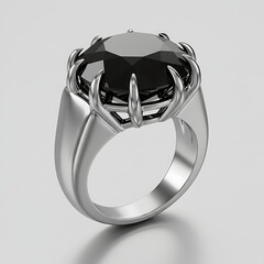 Black gemstone ring with silver claws in modern design  