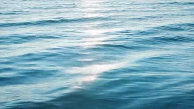 Sunlit Ocean Waves - A Serene Seascape of Tranquility and Reflection.