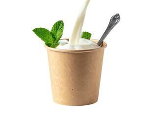 Creamy milk pouring over yogurt in a paper cup with mint