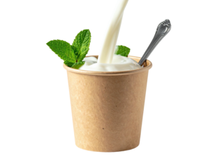 Creamy milk pouring over yogurt in a paper cup with mint