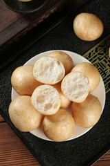 Golden Fried Bubble Bread Rolls on Plate - Asian Hotpot Food Essentials with Airy Texture