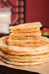 Traditional Shanghai Scallion Pancakes Stack - Chinese Street Food Delicacy with Green Onions