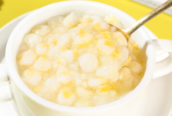 Delicious Fresh Corn Polenta in White Bowl with Spoon Ready to Serve