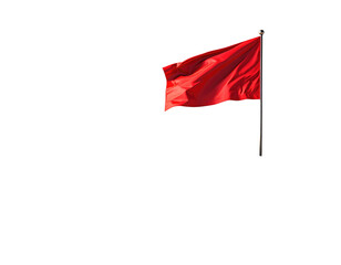 Red flag waving in the wind against a black background