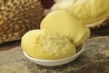 Fresh Golden Durian Fruit Segments in Bowl - Tropical Asian Exotic Delicacy with Creamy Texture