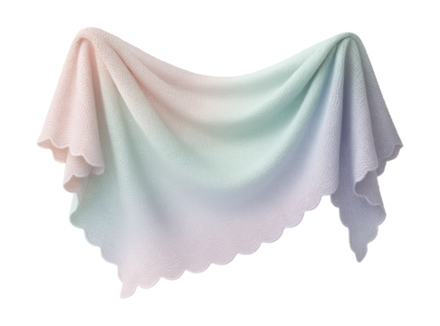 Soft pastel-hued knitted beach shawl with scalloped edges.
