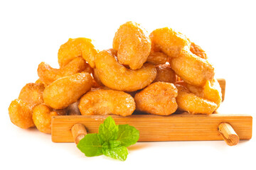Salted roasted cashew nuts with mint and cinnamon on white background - premium healthy snack food