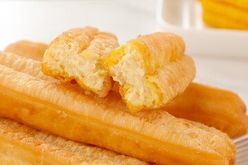 Fresh Golden Corn Fritters Crispy Fried Comfort Food Snack with Fluffy Interior on White Plate