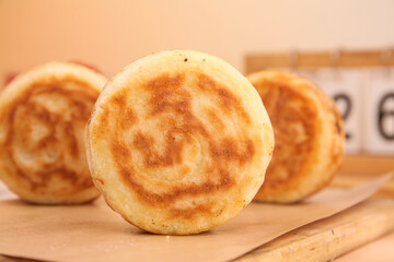 Delicious Pork and Egg Pies with Golden Spiral Pastry on Wooden Board