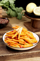 Spicy Chicken Claws with Lemon and Chili Sauce on Rustic Wooden Table - Asian Cuisine Appetizer