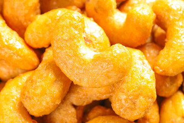 Crispy Salt-Baked Cashew Nuts with Golden Amber Glaze - Healthy Snack Food Background