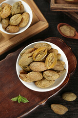 Chaoshan Dried Fruits and Preserved Olives Traditional Chinese Food Ingredients on Wooden Boards