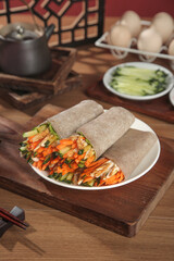 Buckwheat Vegetable Wraps with Fresh Filling on Rustic Wooden Board - Healthy Meal Concept