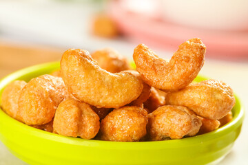 Deep Fried Crispy Cashew Nuts in Green Bowl for New Year Eve Celebration