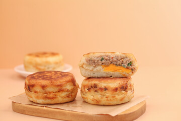 Fresh Meat and Cheese Breakfast Sandwich Biscuits on Wooden Serving Board