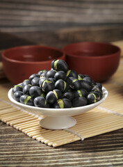 Black Bean Sprouts in White Bowl on Bamboo Mat - Healthy Asian Food Ingredient