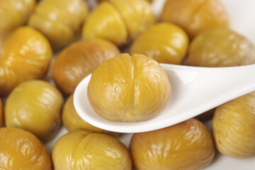 Roasted Chestnuts on White Spoon - Golden Raw Nuts Food Photography