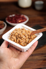 Japanese Natto Fermented Soybeans in Container with Chopsticks Traditional Healthy Food