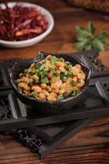 Japanese Natto Fermented Soybeans with Green Onions in Traditional Black Bowl on Wooden Tray