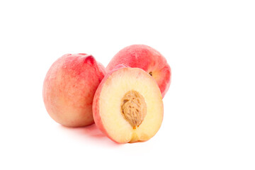 Fresh Ripe Peaches Cut in Half Showing Pit Isolated on White Background