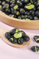 Black Beans with Green Pods on Wooden Spoon - Healthy Legume Food Ingredient