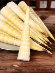 Fresh Bamboo Shoots from Jianou - Traditional Asian Cooking Ingredient on Wooden Background