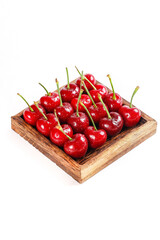 Fresh Red Cherries in Wooden Tray Isolated on White Background