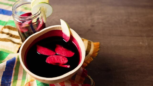 Sobolo, Hibiscus Drink, Vibrant red drink made from dried hibiscus petals, pineapple peels, ginger, cloves, and sweetened to taste
