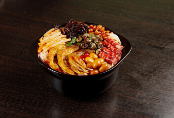Liuzhou Duck Feet Conch Hot Pot Casserole Traditional Chinese Cuisine Black Bowl Dark Wood Table