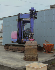 Compact heavy machine prepared at the construction site.