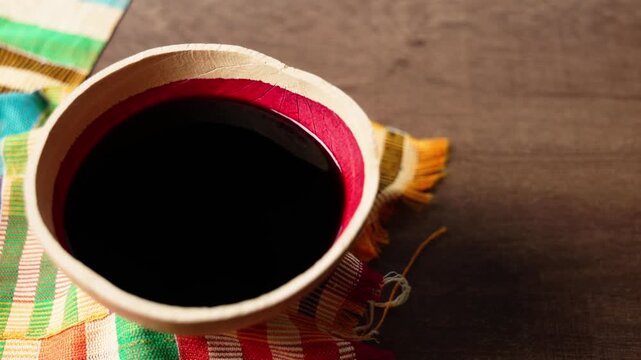 Sobolo, Hibiscus Drink, Vibrant red drink made from dried hibiscus petals, pineapple peels, ginger, cloves, and sweetened to taste