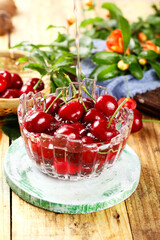 Fresh Red Cherries with Syrup in Crystal Bowl on Wooden Table - Shandong Meiyao Variety