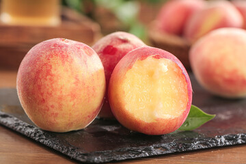Fresh Ripe Peaches Cut in Half on Slate Board - Summer Fruit Display
