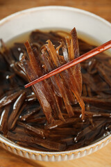 Shredded Salted Kelp Seaweed with Chopsticks in Traditional Bowl - Asian Cuisine