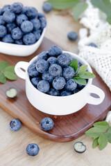 Fresh Blueberries in White Cups on Wooden Board - Healthy Organic Berry Fruit Snack