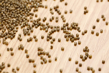 Organic Black Millet Grains on Wood Surface - Healthy Ancient Grain Superfood