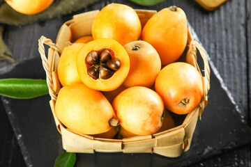 Fresh Sweet Loquat Fruits in Wicker Basket - Healthy Organic Alpine Fruit Display