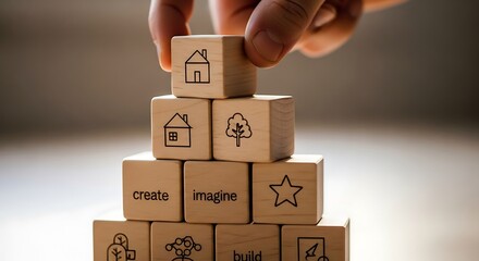 Child stacking cardboard building blocks with simple icons symbolizing home and nature