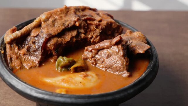 Fufu With Smoked Fish Light Soup and Goat Meat, Africa Ghana Traditional Dish