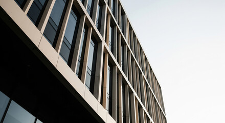 Modern glass office building facade at dusk