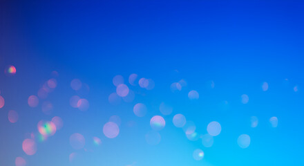 Abstract blue gradient background with bokeh lights for festive occasions