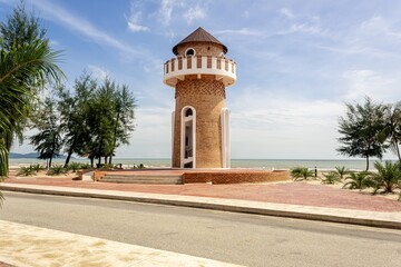 Fototapeta premium Peaceful Park by the Sea with Concrete Bench and watch tower View in Pantai Kempadang, Kuantan Pahang, Malaysia