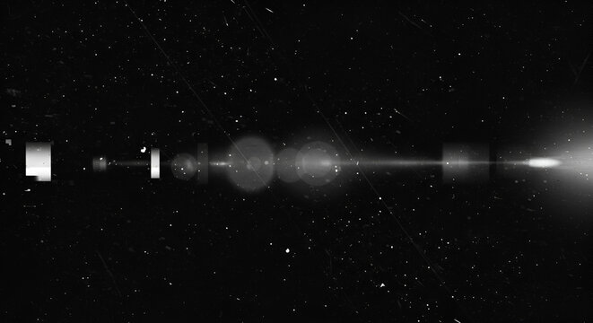 Grungy black and white image with a central lens flare effect for overlay use