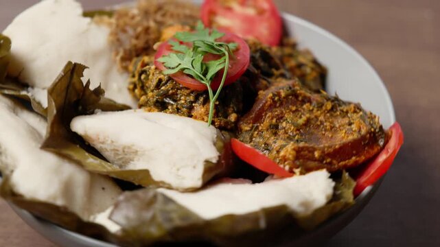 Abolo, Soft Steamed Corn Cakes With Amatadzi Spicy Green Leaf Stew, Agushi, Fried Tuna Chunks, One-Man-Thousand Fish, Africa Ghana Traditional Dish
